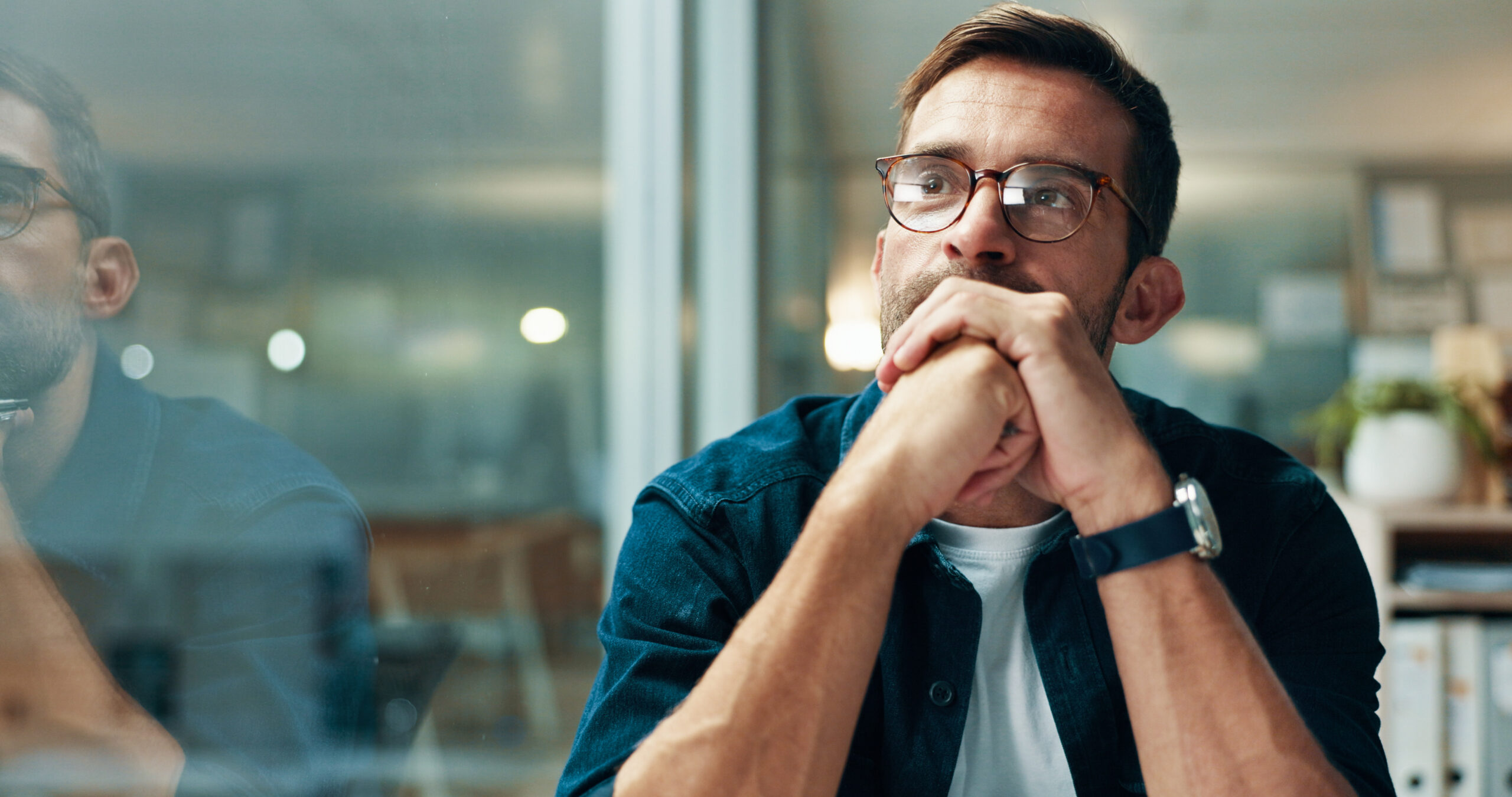 Reflection, thinking and business man with idea, creative insight or professional mindset. Planning, vision and serious worker with inspiration, problem solving and writer by glass in startup office